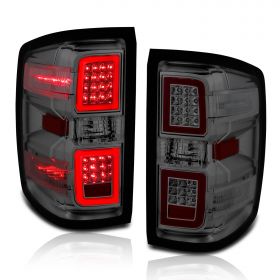 AmeriLite for 2014-2018 Chevy Silverado 1500 2500 3500 GMC Sierra Smoke Lens LED Light Tube Taillights Pair - Driver and Passenger Side
