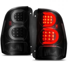 AmeriLite for 2002-2009 Chevy Trailblazer / EXT Smoke Black C-Type LED Tube Tail Lights Brake Lamps Pair - Driver and Passenger Side