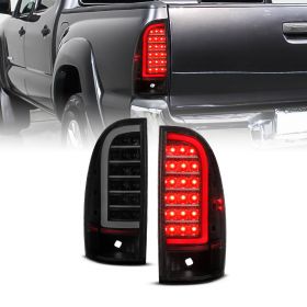 AmeriLite for 2005-2015 Toyota Tacoma Truck C-Type LED Tube Smoke Black Tail Light Assembly Set - Driver and Passenger Side