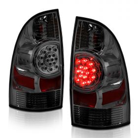 AmeriLite for 2005-2015 Toyota Tacoma Crystal Smoke LED Rear Brake Lamp Replacement Taillights Set + Bulbs Socket - Passenger and Driver Side