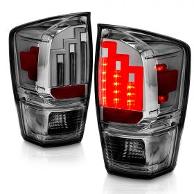 AmeriLite for 2016-2022 Toyota Tacoma Pickup Truck LED Tube Parking Lamp Smoke Chrome Tail Lights Assembly - Driver and Passenger Side