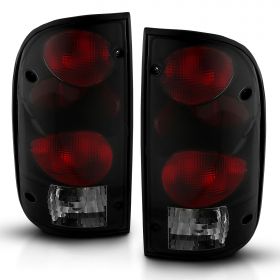 AmeriLite for 1995-2000 Toyota Tacoma Black Smoke Replacement Tail Lights w/Bulb Harness Set - Passenger and Driver Side.