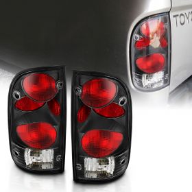 AmeriLite for 1995-2000 Toyota Tacoma Black Replacement Tail Lights Set + Bulb & Harness - Passenger and Driver Side.