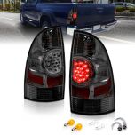 AmeriLite for 2005-2015 Toyota Tacoma Crystal Smoke LED Rear Brake Lamp Replacement Taillights Set + Bulbs Socket - Passenger and Driver Side
